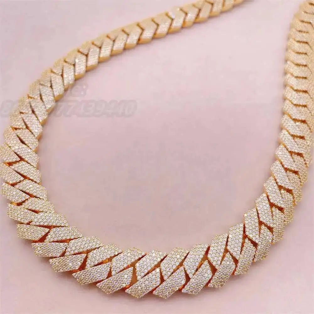 Gold chain necklace on a pink background