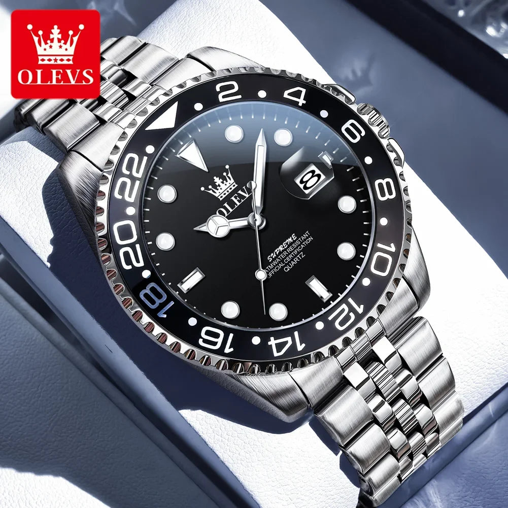 Silver watch with black dial on a reflective surface, featuring the OLEVS brand.
