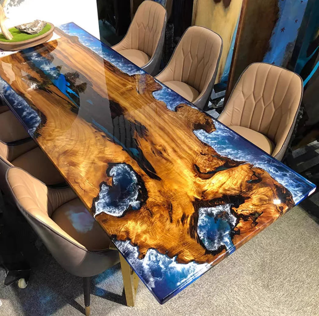 Dining table with a unique design featuring blue resin embedded in wood, surrounded by chairs.