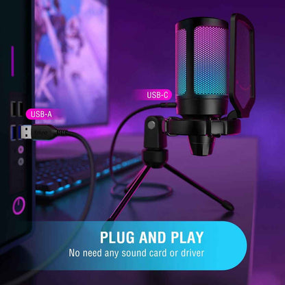 Microphone on a stand with USB cables in front of a computer screen, on a purple background.