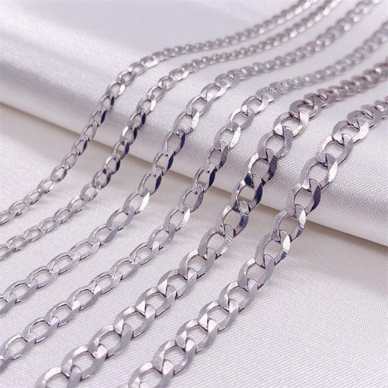 925 Sterling Silver Cuban Link Chain Necklace - Multiple chains on fabric