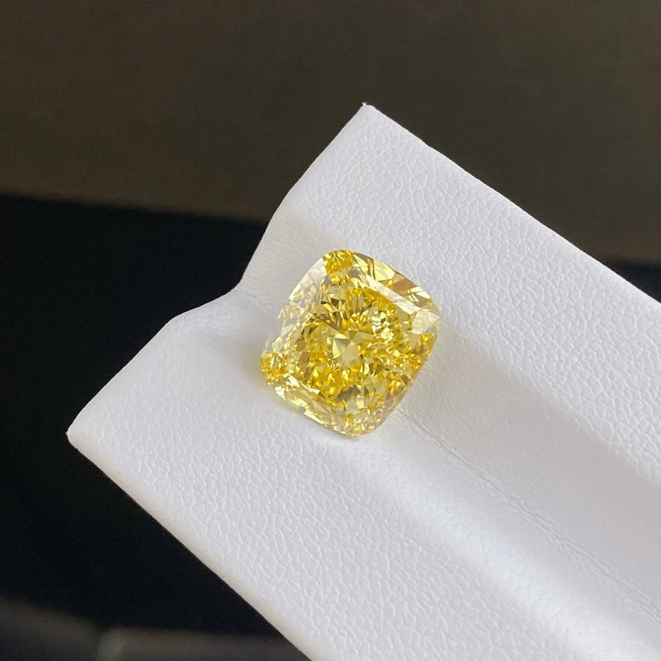 9.06ct Fancy Vivid Yellow cushion brilliant lab grown diamond close-up – IGI VS1