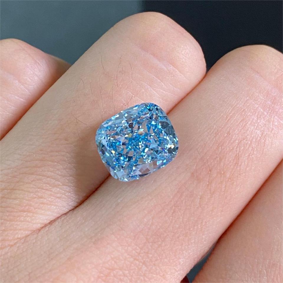 5.83CT Fancy Intense Blue lab-grown cushion cut diamond in display tray