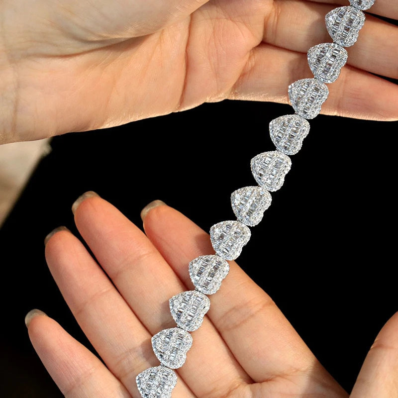 18K White Gold Heart Diamond Bracelet close-up on fingers