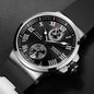 Luxury watch with black dial and silver case on a dark background