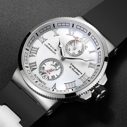 Silver wristwatch with a detailed face on a dark background