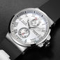 Silver wristwatch with a detailed face on a dark background