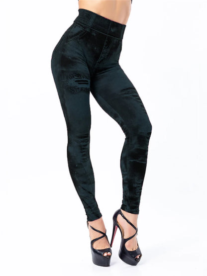 Black high-waisted jeans worn by a person on a white background