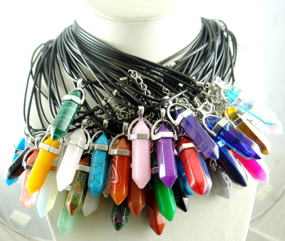 Colorful crystal pendant necklaces on a mannequin.