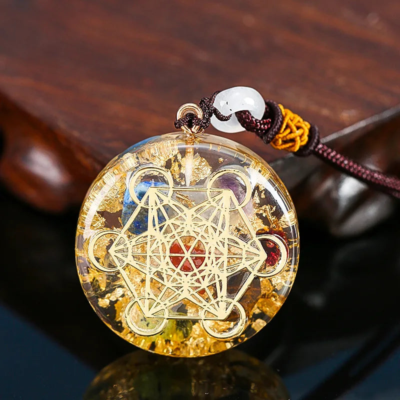 Decorative pendant with geometric design on a reflective surface