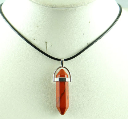 Necklace with a red stone pendant on a white background