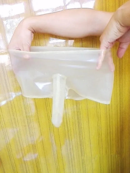 Person holding a clear plastic bag with a white object inside on a yellow background