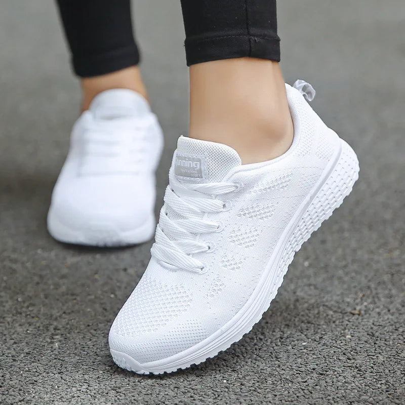 White sneakers on a gray pavement