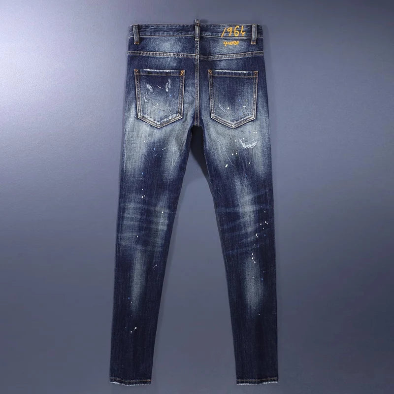 Blue distressed jeans on a gray background