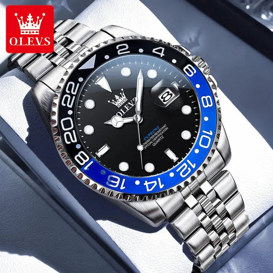 Silver watch with black and blue bezel on a white surface, featuring the OLEVS brand.