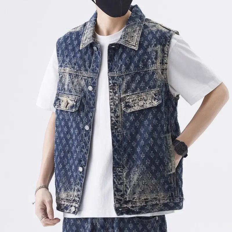 Person wearing a blue denim vest over a white shirt on a white background