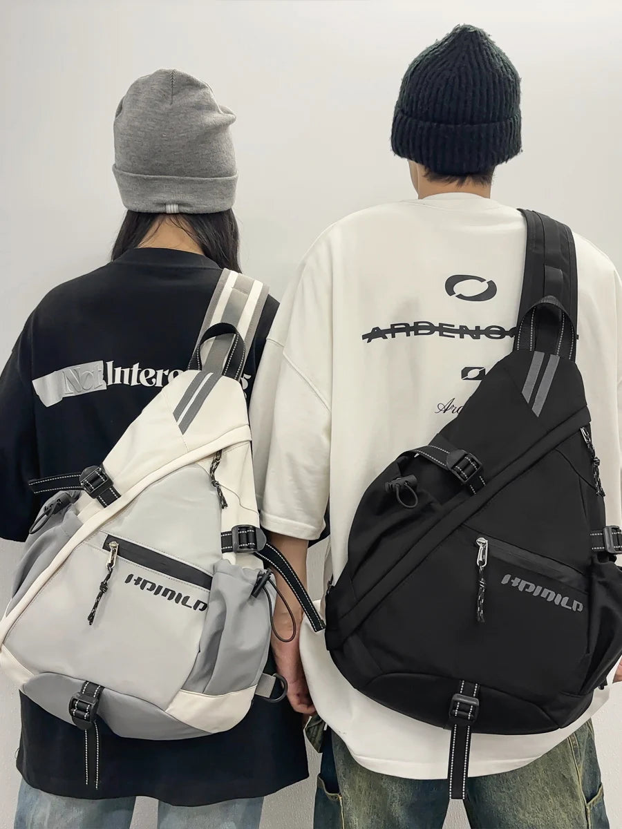 Two people wearing backpacks with a brand logo on a plain background