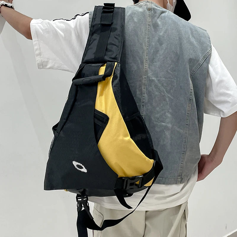 Person wearing a black and yellow backpack on a plain background