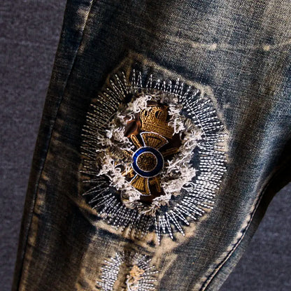 Close-up of a decorative patch on a denim jacket with intricate design.