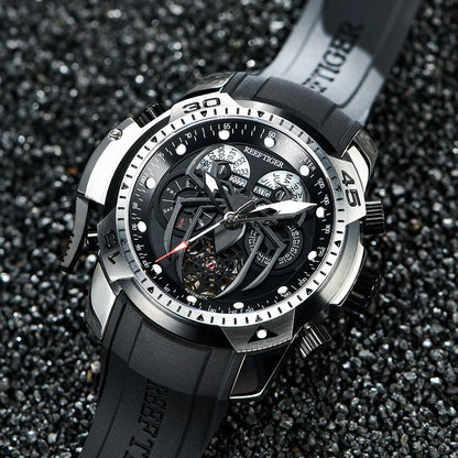 Black and silver watch with detailed face on a dark textured background