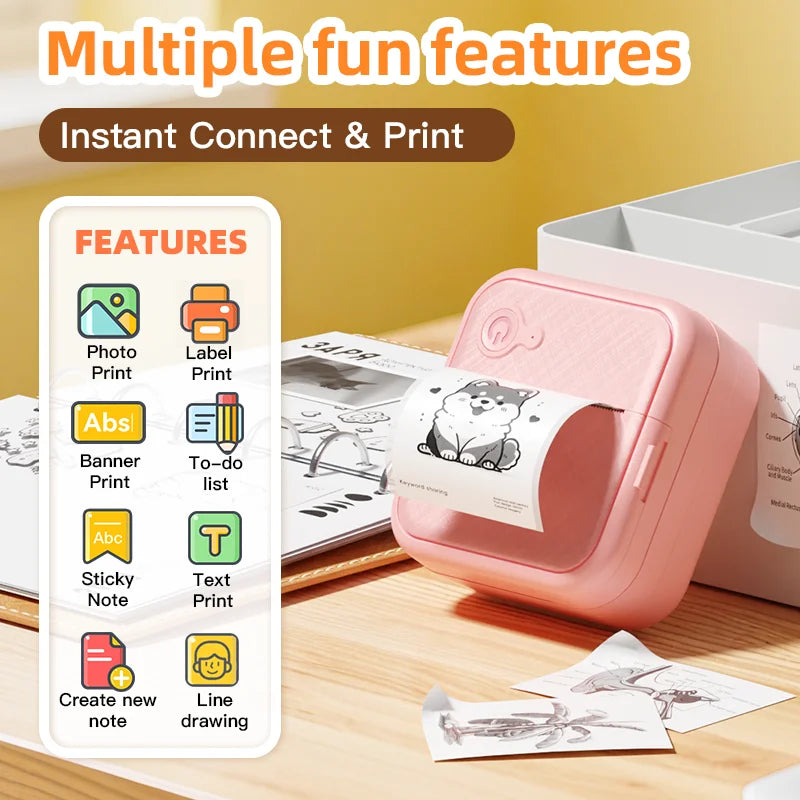 Pink portable printer with features listed on a wooden surface