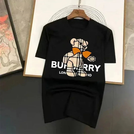 Black t-shirt with Burberry bear logo on a hanger against a neutral background