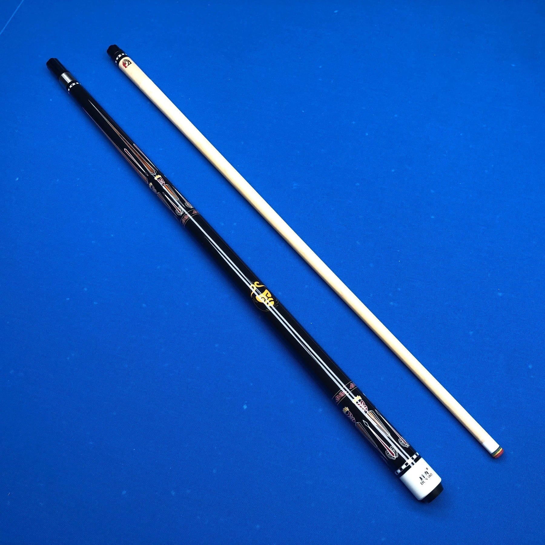 Two pool cues on a blue background