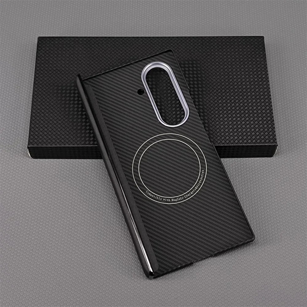 Black phone case with carbon fiber texture on a gray surface