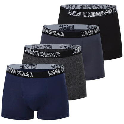 Four pairs of men's underwear in black, gray, and navy with branded waistbands on a white background.