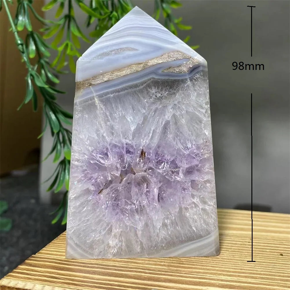 Crystal tower with purple interior on a wooden surface, labeled with dimensions.