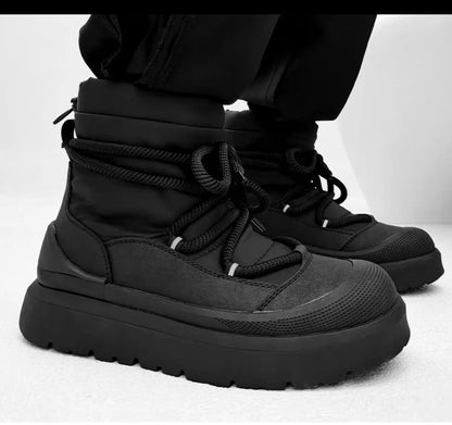 Black winter boots on a white background