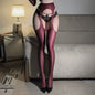 Person wearing maroon stockings and black lingerie in a room with a lamp and sofa.