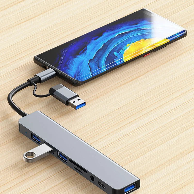 USB hub connected to a smartphone on a wooden surface