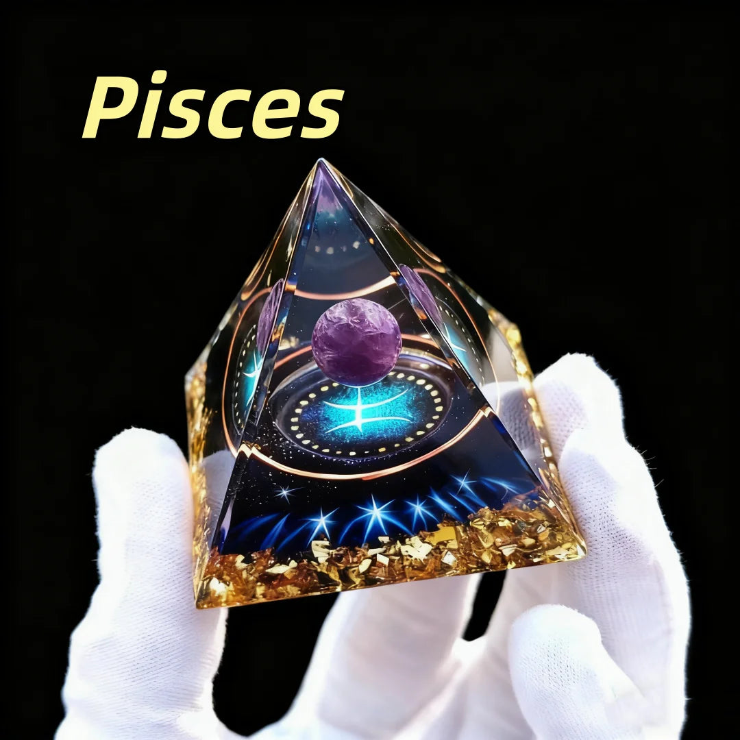 Triangular crystal with astrological design labeled 'Pisces' held by a gloved hand against a black background.