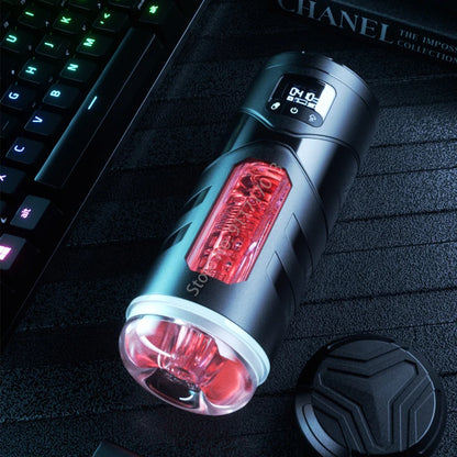 Black and red flashlight on a dark surface with a laptop in the background
