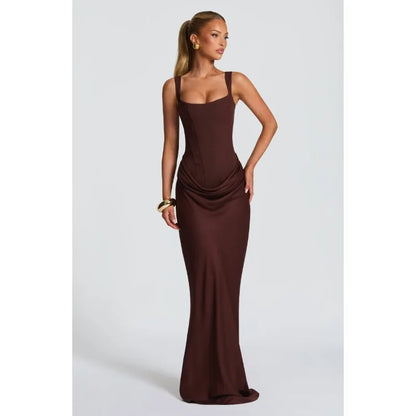 Woman wearing a brown evening gown on a white background