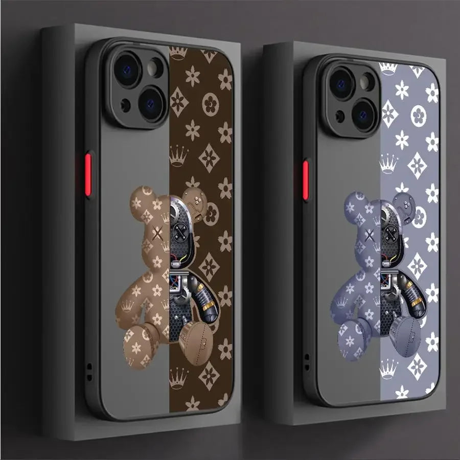 Two phone cases with teddy bear and butterfly designs on a dark background