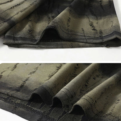Close-up of distressed denim fabric with a white background