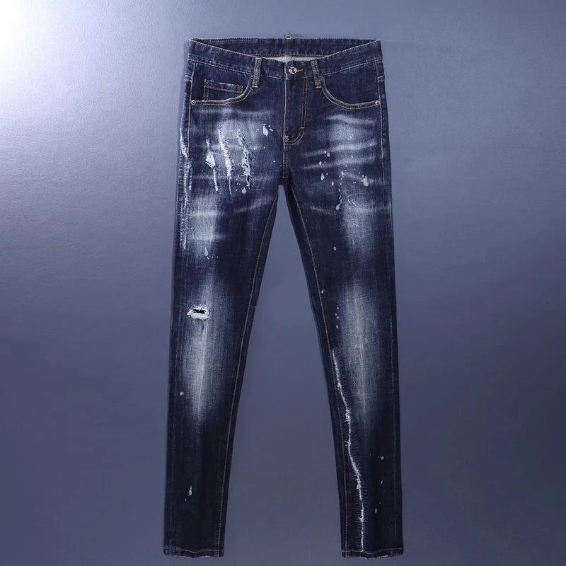 Distressed blue jeans on a gray background