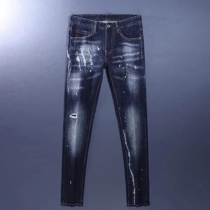 Distressed blue jeans on a gray background