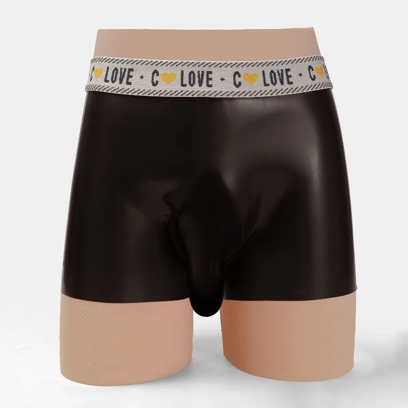 Black boxer briefs with a patterned waistband on a mannequin against a white background