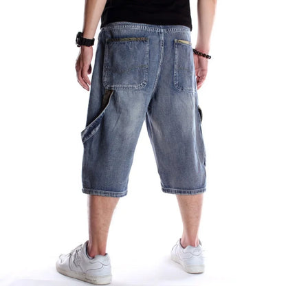 Person wearing blue denim shorts on a white background