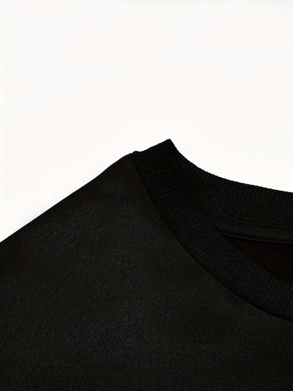 Close-up of a black garment on a white background