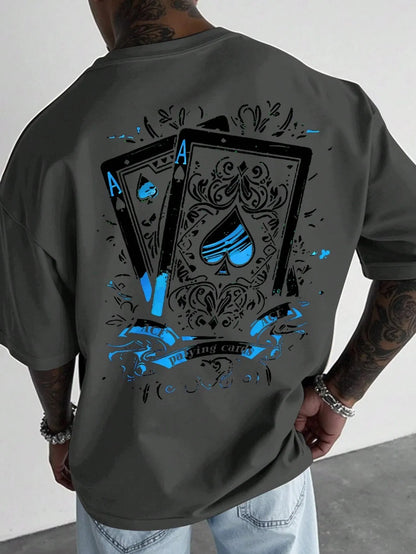 Person wearing a gray t-shirt with playing card design on the back