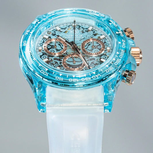A close-up of a Swatch wristwatch featuring a translucent light blue case, a white silicone strap, and rose gold-tone chronograph pushers and subdials.