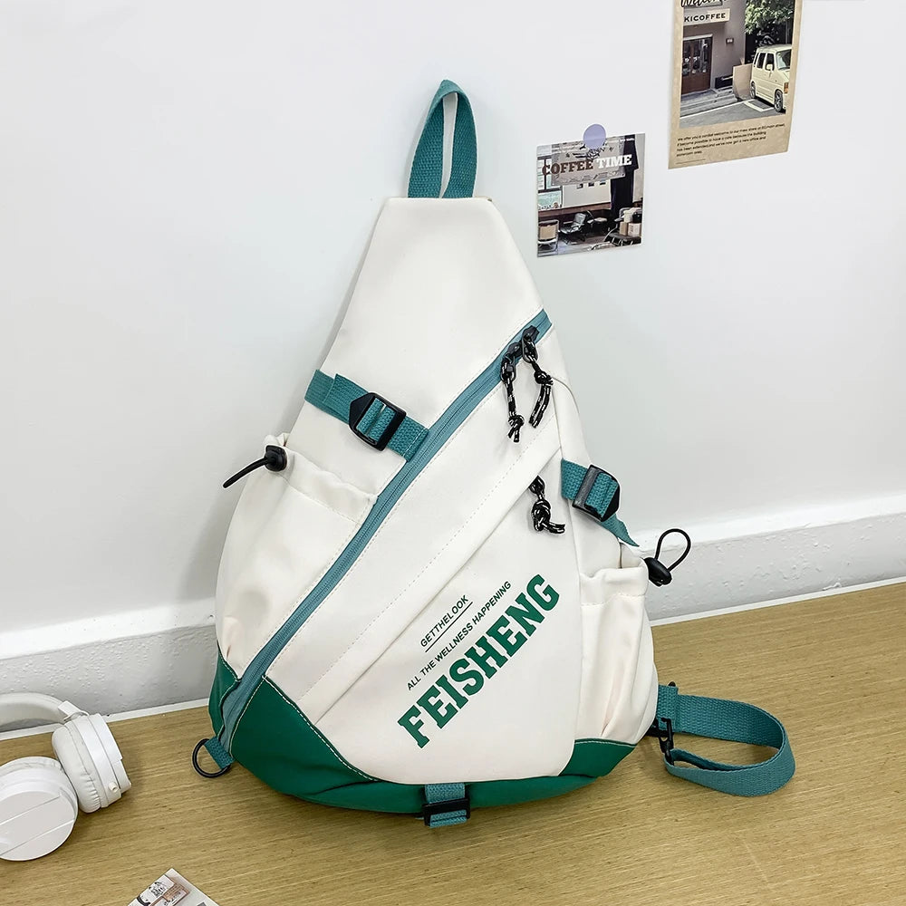 White and green sling bag with 'FEISHENG' branding on a wooden surface.