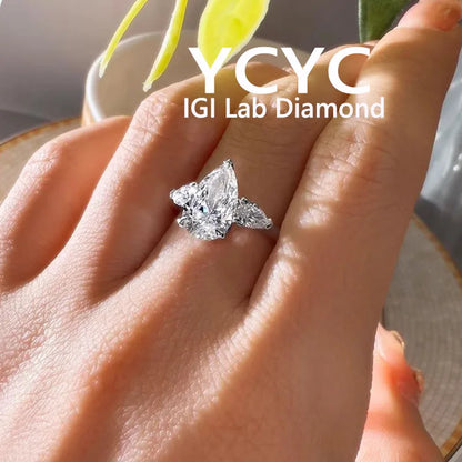 Diamond ring on a hand with 'YCYC IGI Lab Diamond' branding.