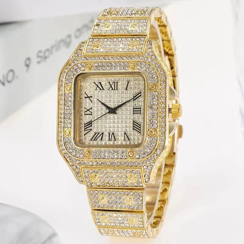 Gold watch with diamond accents on a white background