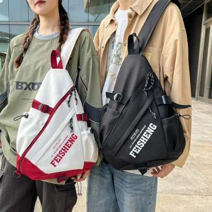 Two people holding FEISHENG bags, one white and red, the other black.