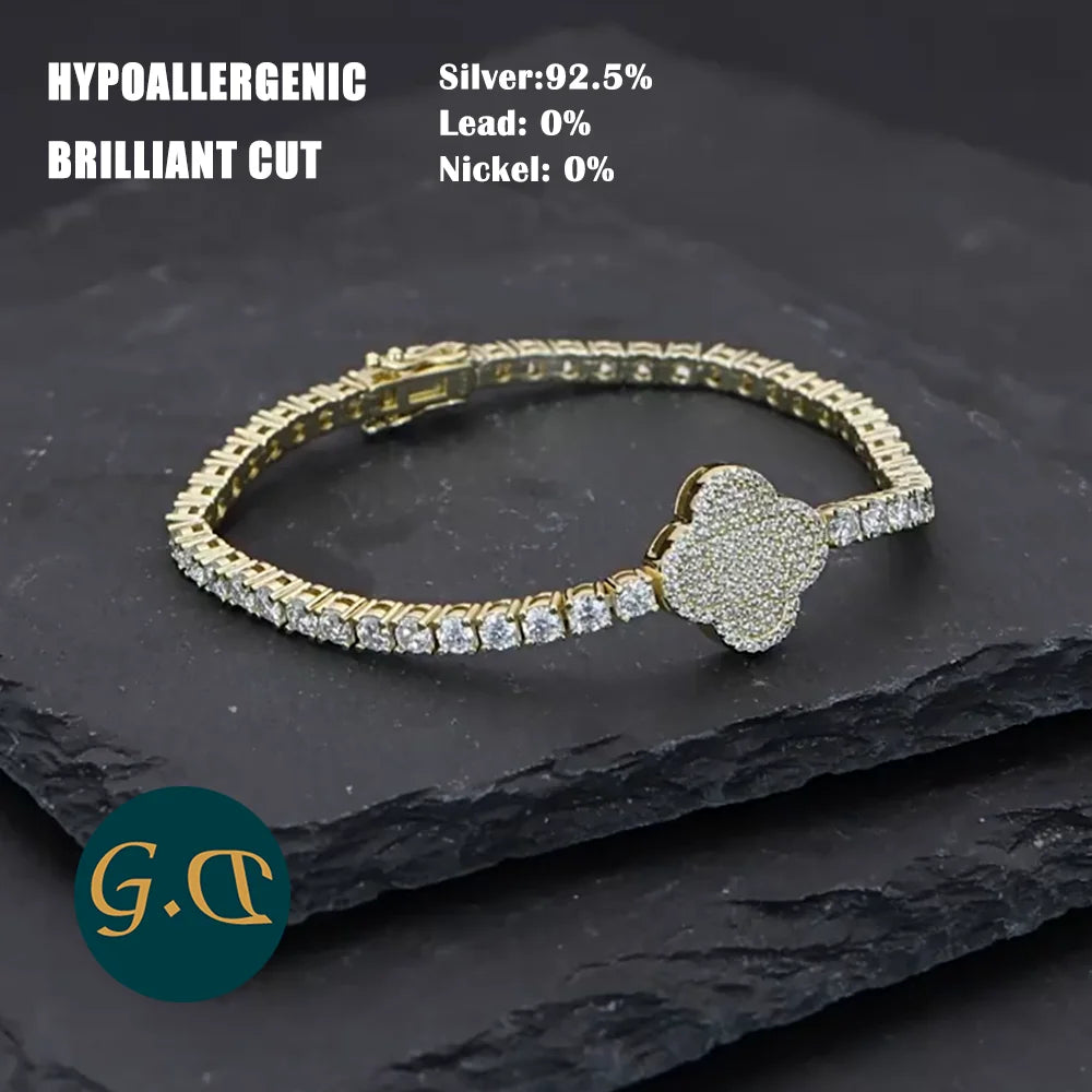 Gold bracelet with diamond accents on a dark stone surface, featuring hypoallergenic information.